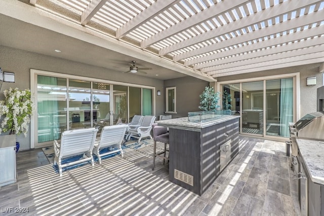 view of patio / terrace featuring a pergola and ceiling fan