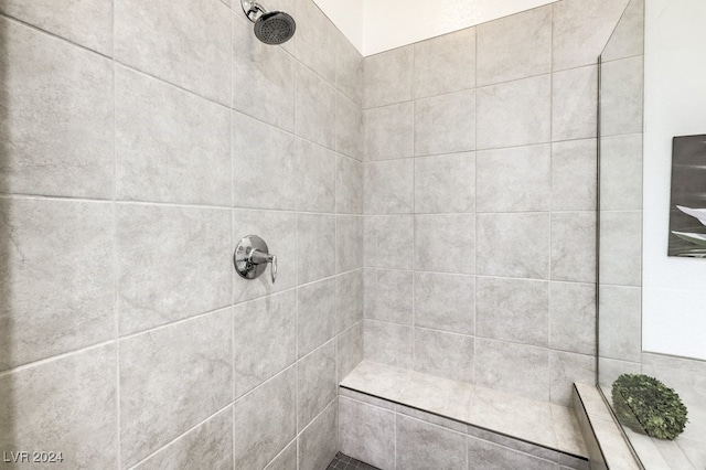 bathroom with a tile shower