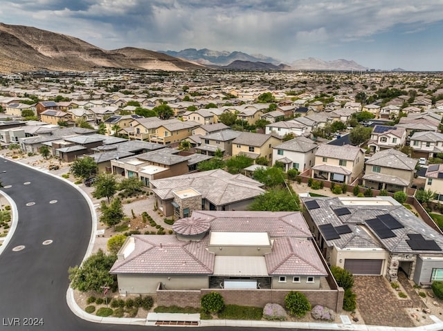 birds eye view of property featuring a mountain view