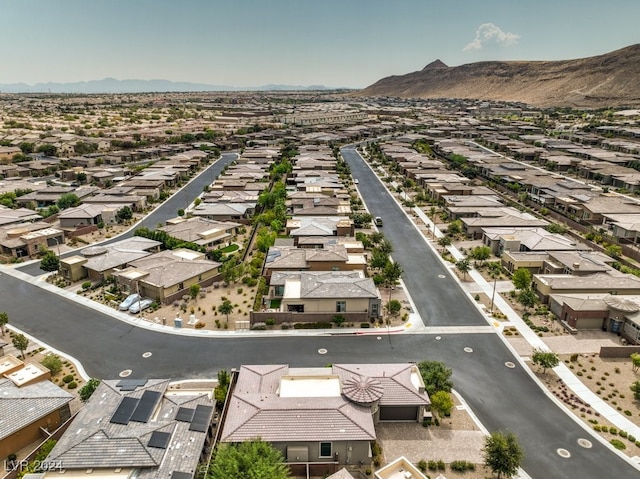 birds eye view of property featuring a mountain view