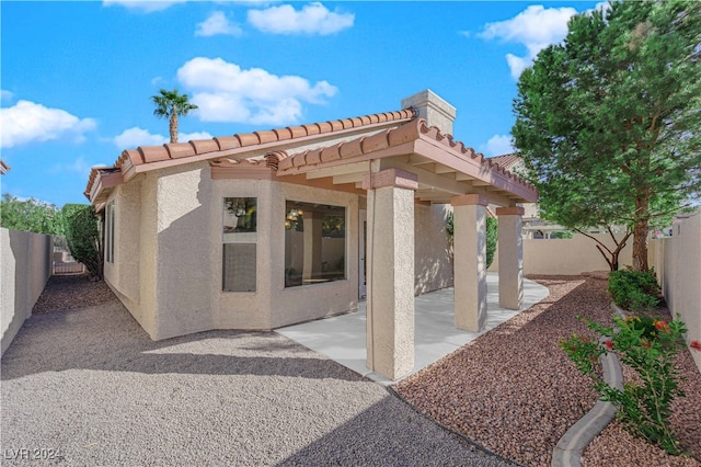 rear view of property with a patio area