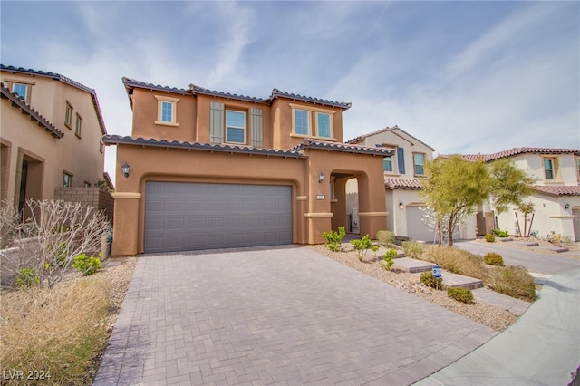 mediterranean / spanish-style house featuring a garage