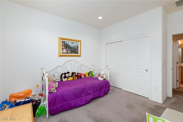 bedroom with a closet and carpet