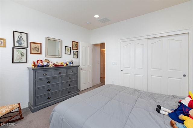 carpeted bedroom with a closet