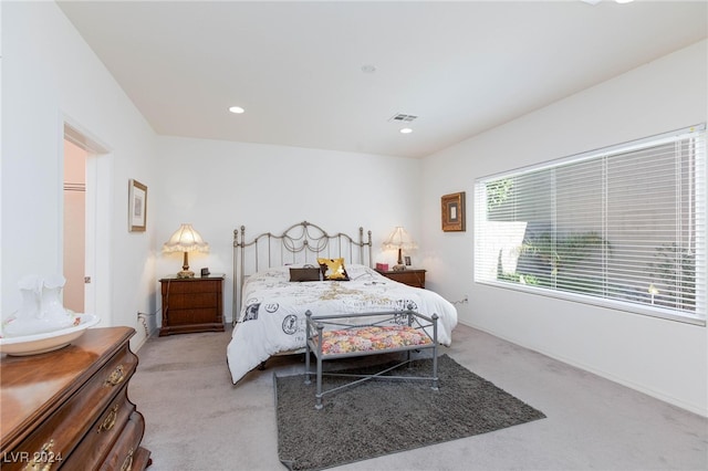 bedroom featuring light carpet