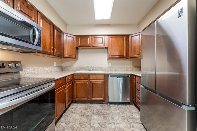 kitchen with appliances with stainless steel finishes and sink