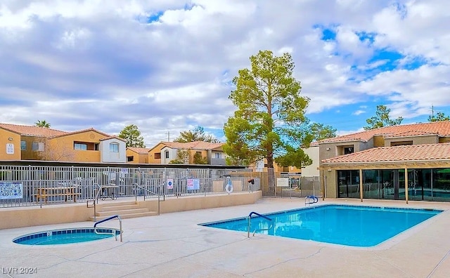 view of swimming pool featuring a patio area