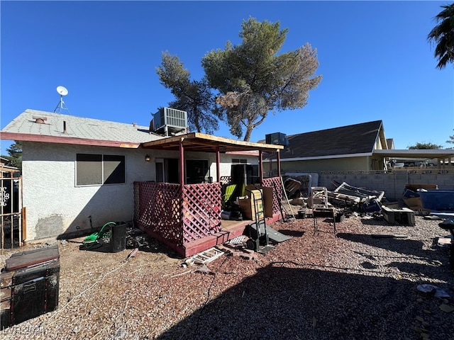 back of property with central AC unit