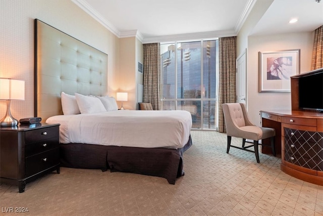 bedroom featuring multiple windows and crown molding