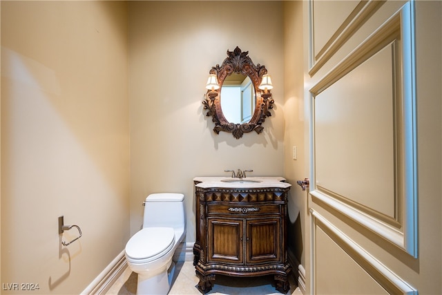 bathroom featuring vanity, toilet, and tile patterned floors