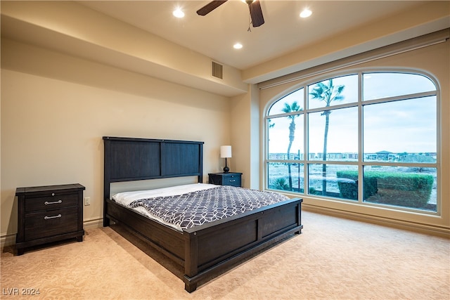 bedroom featuring ceiling fan and light colored carpet