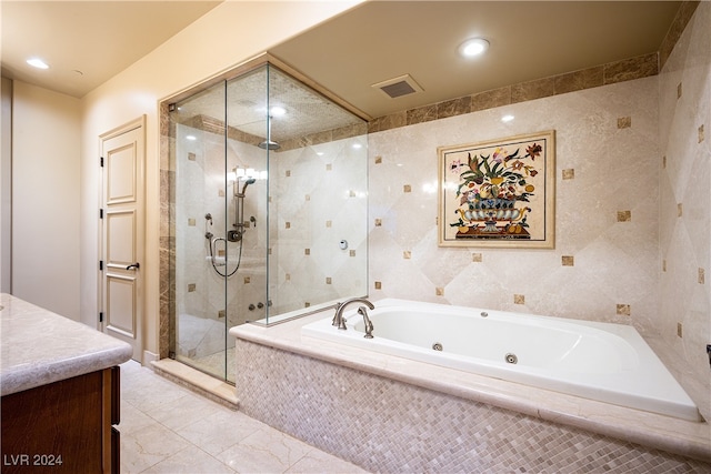 bathroom featuring vanity and plus walk in shower