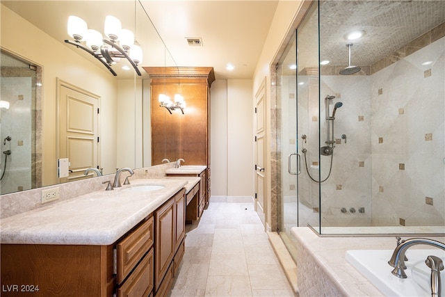 bathroom featuring vanity and separate shower and tub