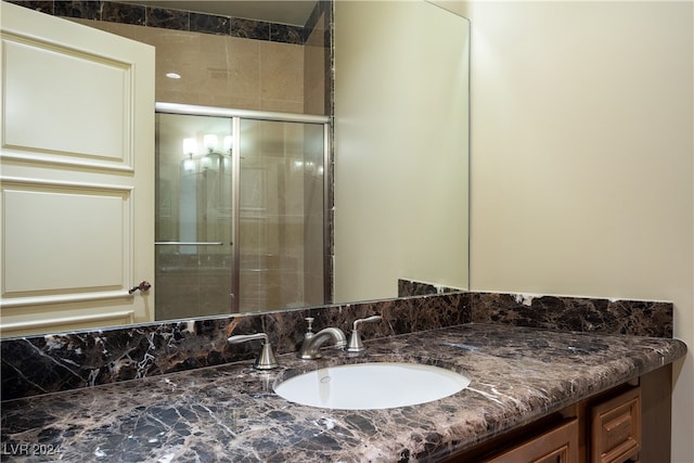 bathroom with vanity and an enclosed shower