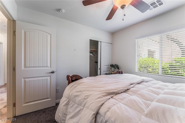 bedroom with ceiling fan, a closet, and carpet