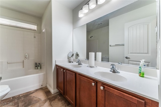 full bathroom featuring vanity, toilet, and shower / bath combination