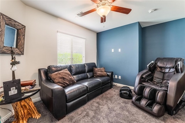 carpeted living room with ceiling fan