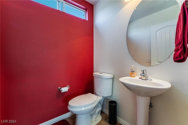 bathroom with sink and toilet