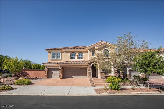 mediterranean / spanish-style house featuring a garage