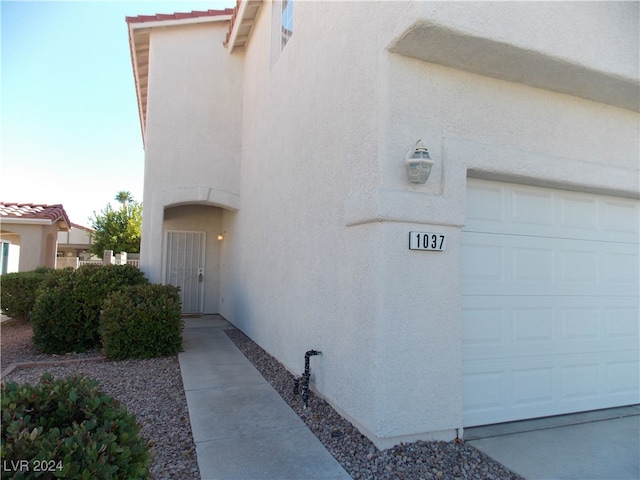 view of property exterior featuring a garage