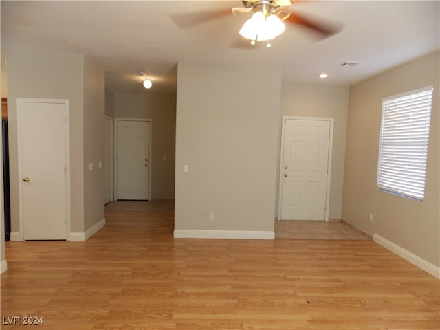 empty room featuring light hardwood / wood-style floors and ceiling fan