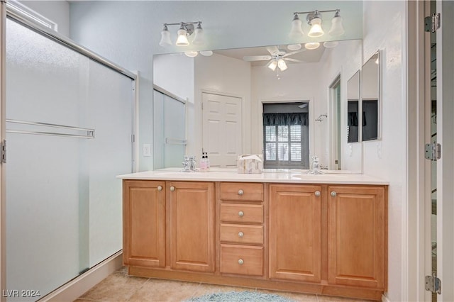7457 Widewing Dr, North Las Vegas, NV 89084 - full bath featuring a shower stall, a ceiling fan, double vanity, tile patterned flooring, and baseboards