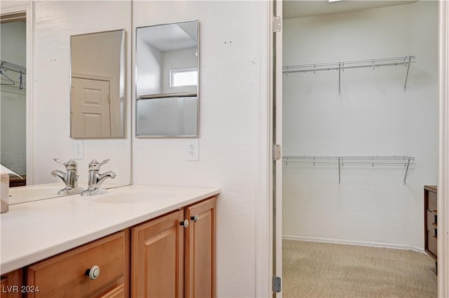 7457 Widewing Dr, North Las Vegas, NV 89084 - bathroom featuring vanity and a spacious closet