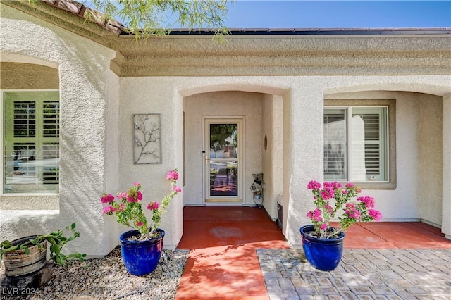 7457 Widewing Dr, North Las Vegas, NV 89084 - doorway to property featuring stucco siding