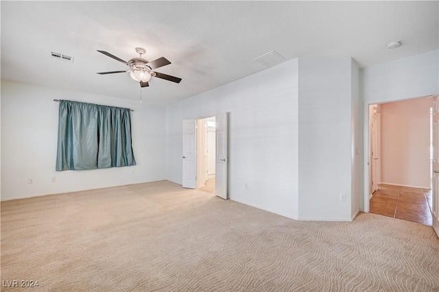 7457 Widewing Dr, North Las Vegas, NV 89084 - unfurnished room with a ceiling fan, light carpet, and a smoke detector