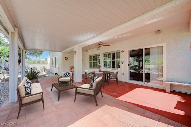 7457 Widewing Dr, North Las Vegas, NV 89084 - view of patio featuring outdoor dining area, ceiling fan, and fence