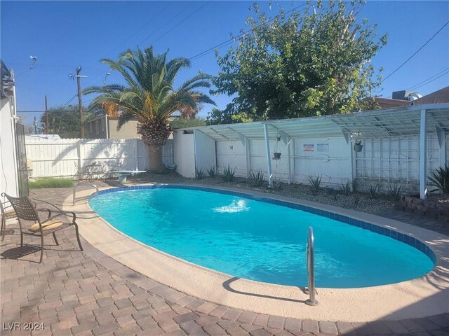 view of swimming pool featuring a patio