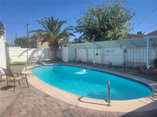 view of pool featuring a patio, a fenced backyard, and a fenced in pool