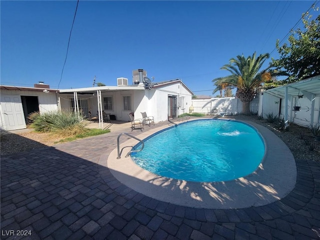 view of pool with a fenced backyard, a fenced in pool, and a patio