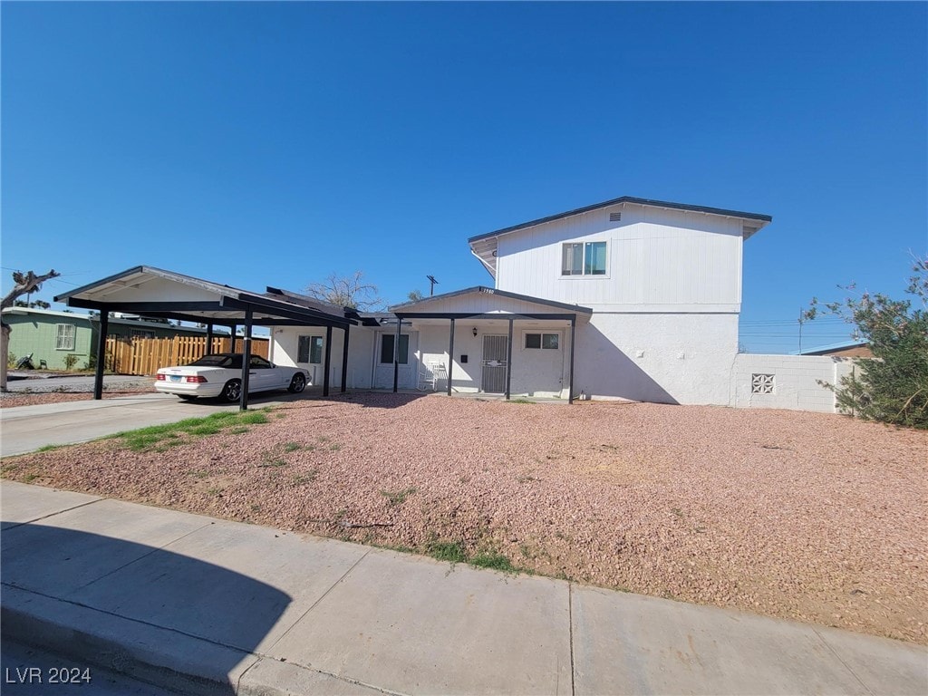 view of front of home featuring a carport