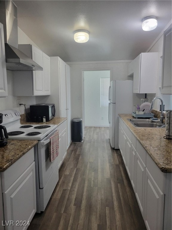 kitchen with wall chimney exhaust hood, sink, white appliances, and white cabinetry