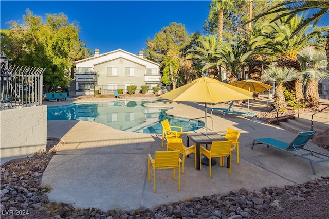 view of swimming pool featuring a patio