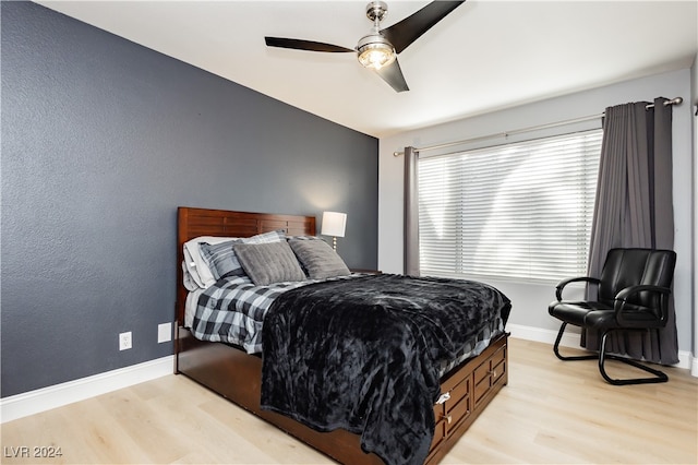 bedroom featuring light wood-type flooring and ceiling fan