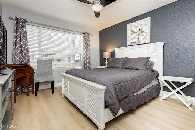 bedroom featuring light wood-type flooring and ceiling fan