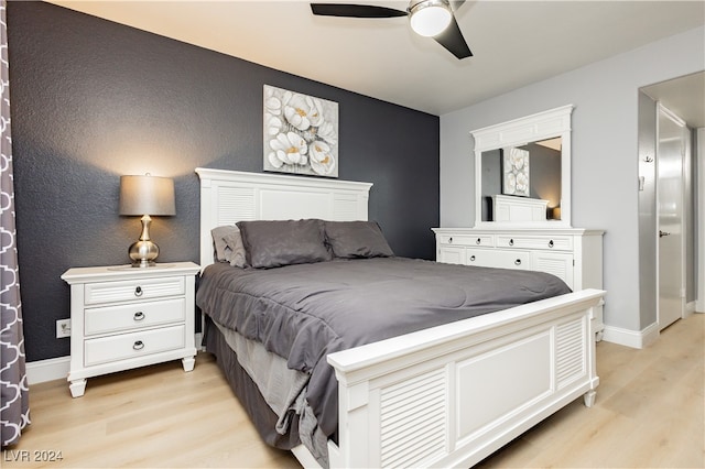 bedroom featuring ceiling fan and light hardwood / wood-style floors