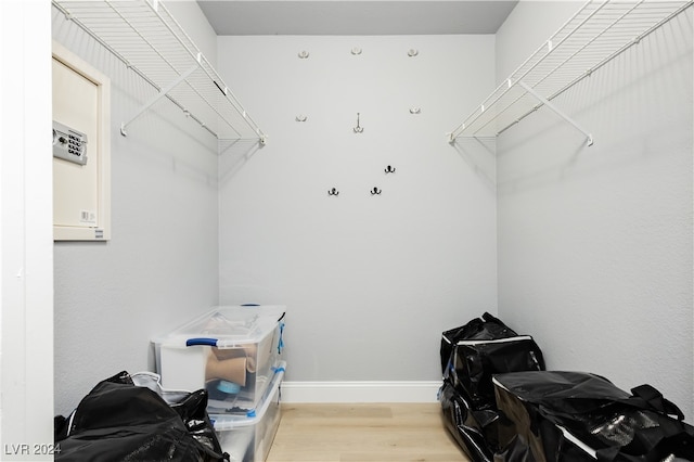 walk in closet featuring light hardwood / wood-style flooring