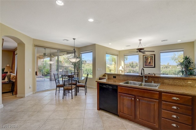 kitchen with ceiling fan, pendant lighting, sink, light tile patterned floors, and dishwasher