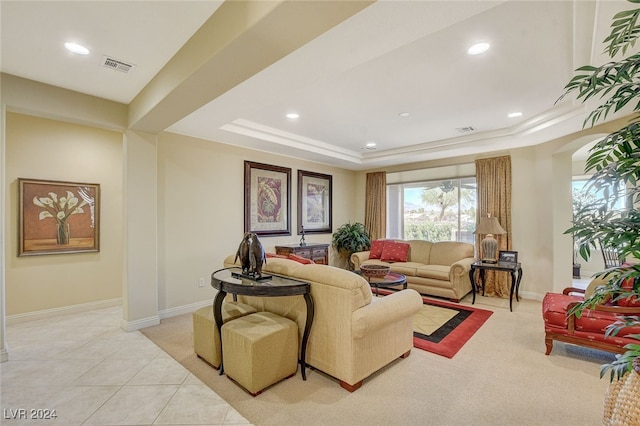 tiled living room with a raised ceiling