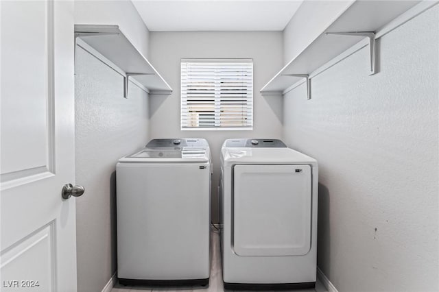 washroom with washing machine and dryer