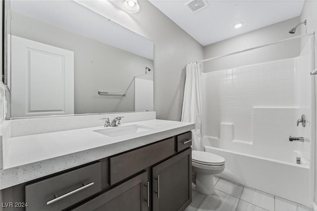 full bathroom featuring tile patterned flooring, shower / bath combo, vanity, and toilet