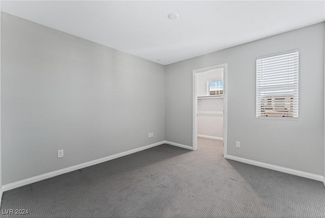 unfurnished room featuring carpet flooring