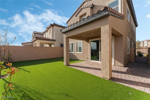 back of house with a patio area