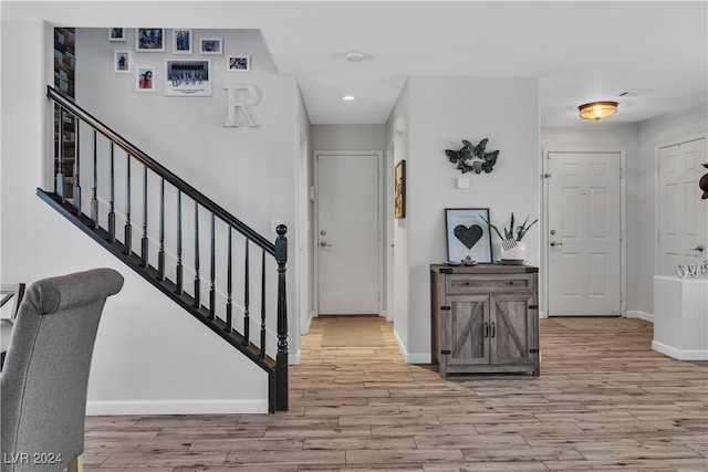 entryway with light hardwood / wood-style flooring