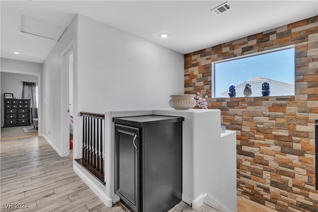 bar featuring light hardwood / wood-style flooring