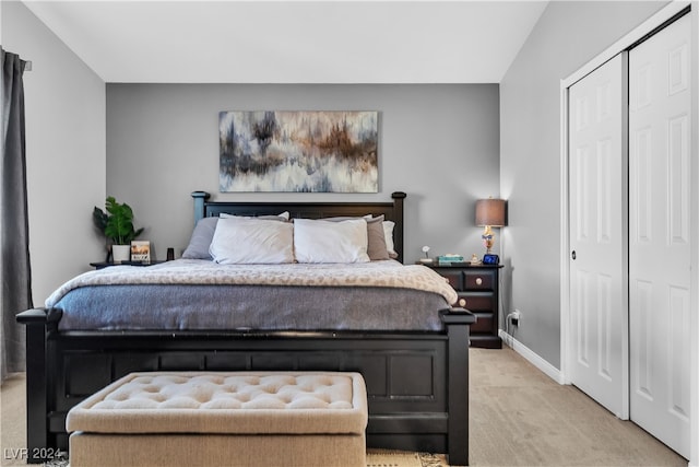 carpeted bedroom with a closet