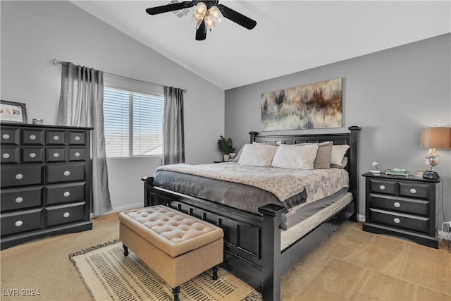 carpeted bedroom featuring ceiling fan and vaulted ceiling